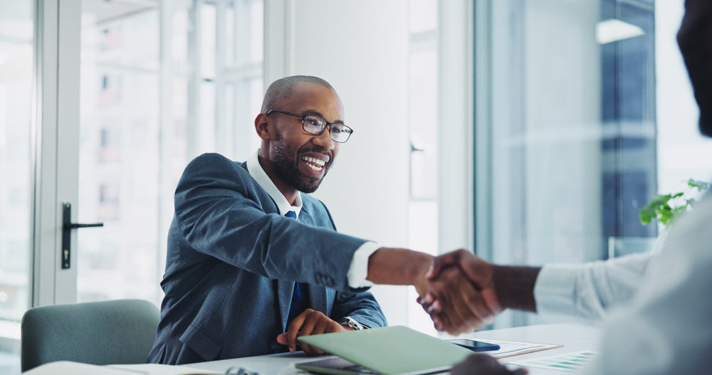 Prostate cancer expert shaking hands with patient
