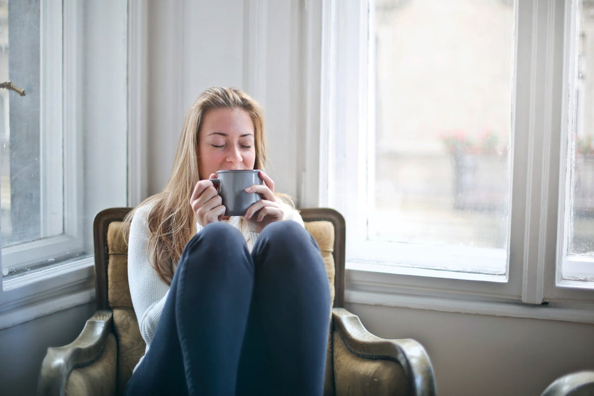 young woman relaxing with coffee cup