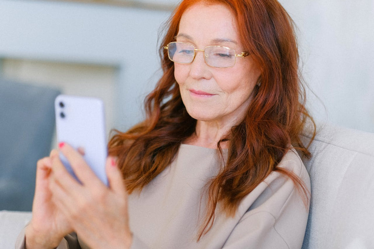 middle aged woman checking her phone