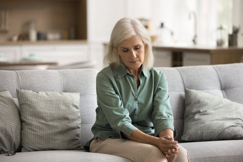 Woman sitting on a couch in a living room
