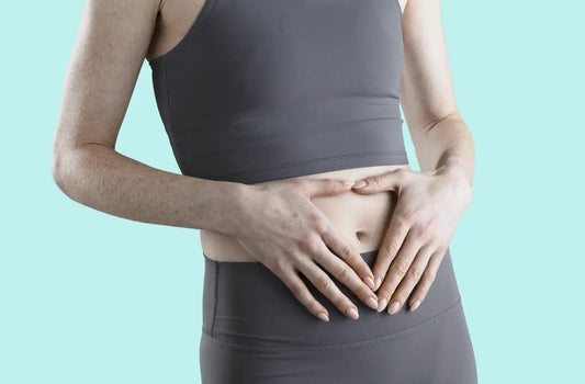 woman holding her stomach