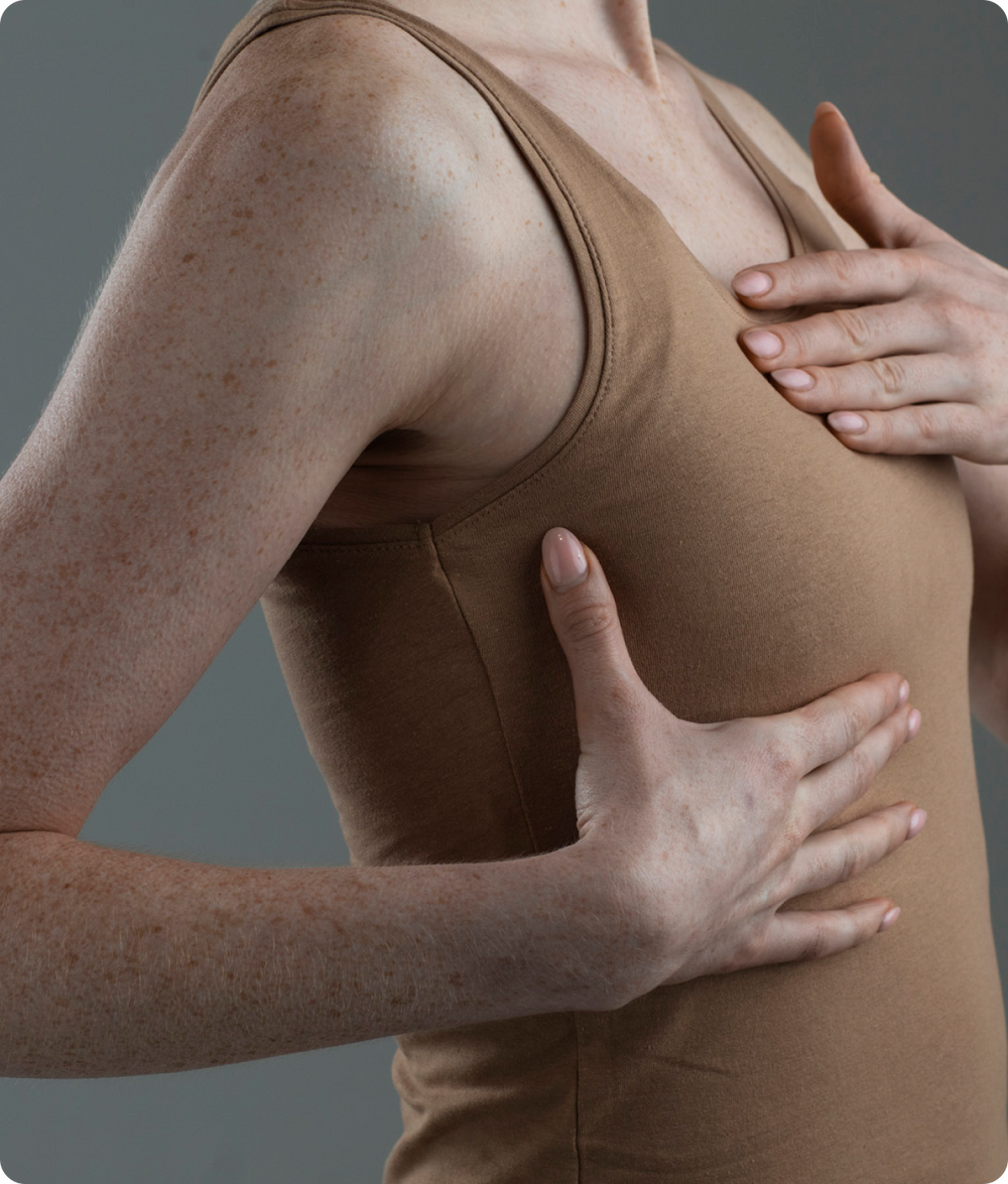 girl showing breast spots for breast screening page