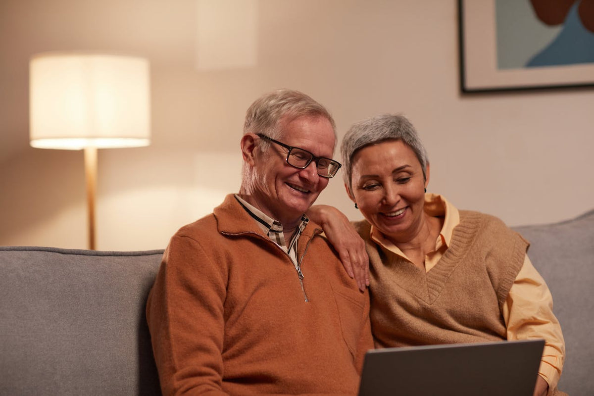 middle aged couple checking cancer test results on computer