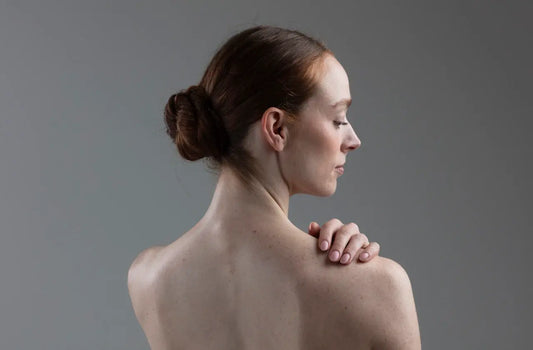 30 year old woman facing away from camera expostng her back